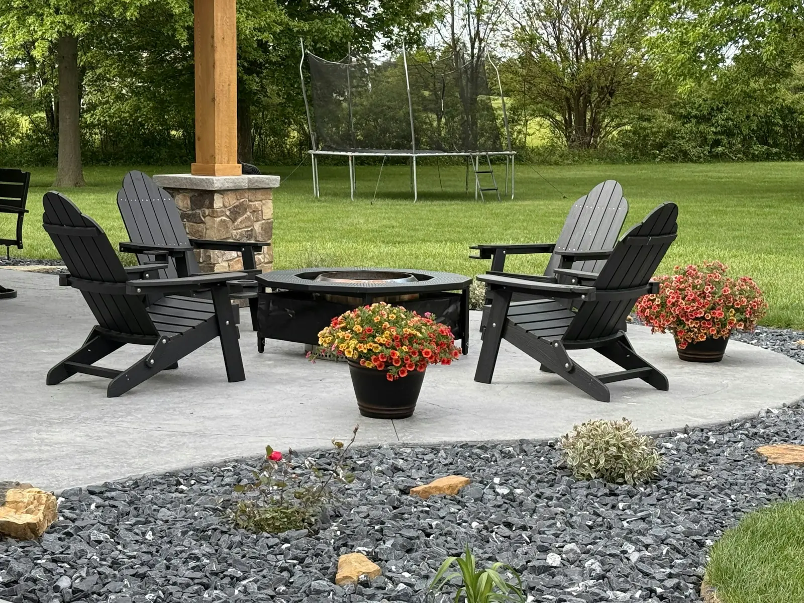 Patio with fire pit and Adirondack chairs