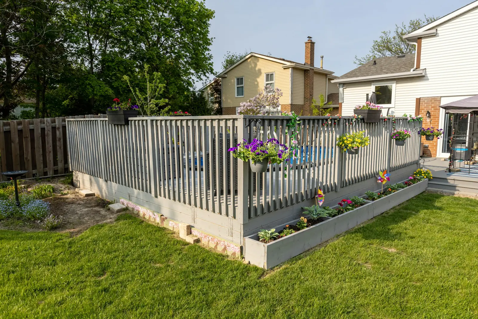 New lawn with fencing and raised flower beds