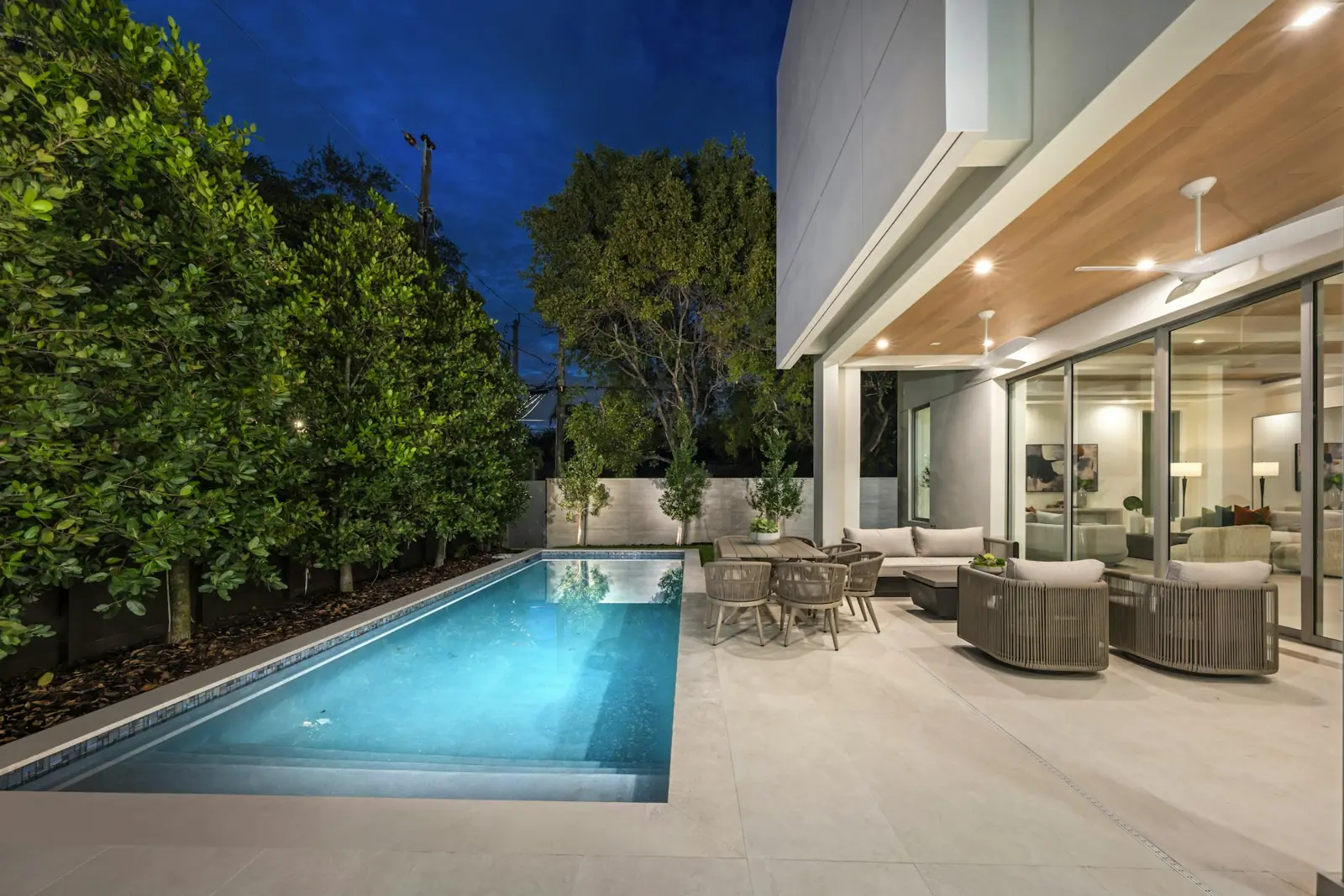 Pool terrace with outdoor lounge at dusk